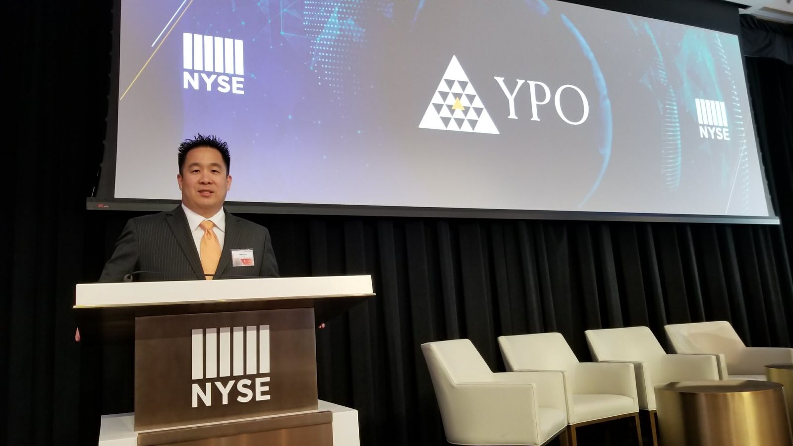 Tejune Kang speaking at the New York Stock Exchange for YPO Global